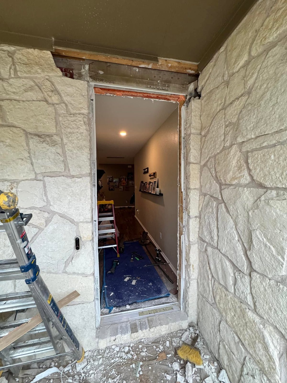 Front doorway torn open mid-renovation before the new door was installed