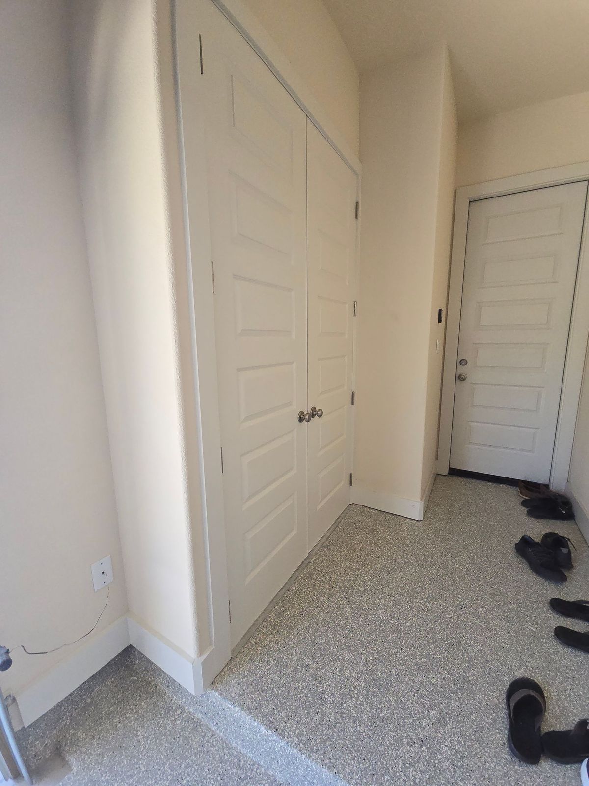 Finished interior entry with fresh drywall and paint